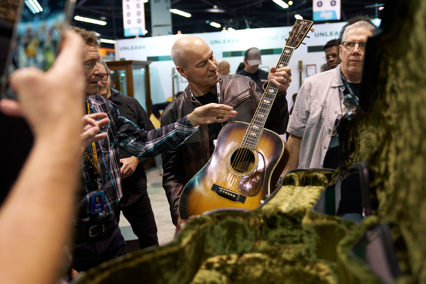 Person checking out the guitar